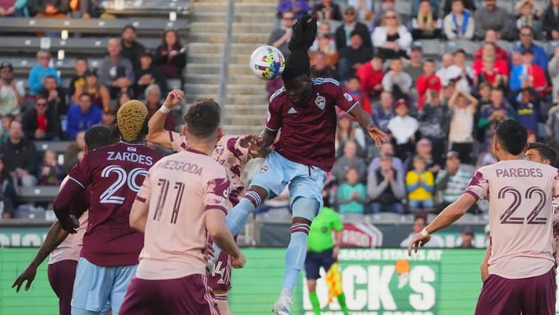 eApr 30, 2022; Commerce City, Colorado, USA; Colorado Rapids defender Lalas Abubakar (6) heads the ball against the Portland Timbers in the first half at Dick's Sporting Goods Park. Mandatory Credit: Ron Chenoy-USA TODAY Sports