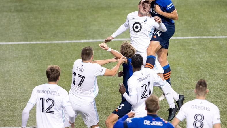 FC Cincinnati defender Nick Hagglund (14) heads the ball over Minnesota United defender Chase Gasper (77) in the second half of the MLS match between FC Cincinnati and Minnesota United at Nippert Stadium in Cincinnati.
Minnesota United At Fc Cincinnati