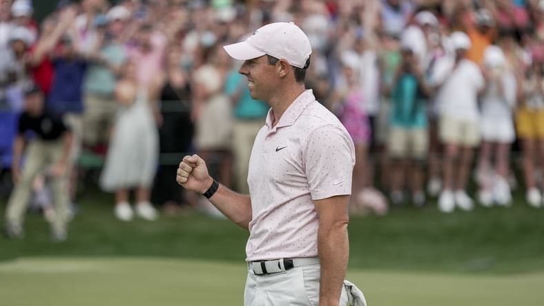 May 9, 2021; Charlotte, North Carolina, USA; Rory McIlroy gives a fist bump after securing his third Wells Fargo championship during the final round of the Wells Fargo Championship golf tournament. Mandatory Credit: Jim Dedmon-USA TODAY Sports