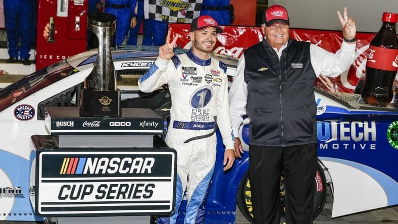 May 30, 2021; Concord, North Carolina, USA;  NASCAR Cup Series driver Kyle Larson (5) celebrates his win with team owner Rick Hendrick at the Coca-Cola 600 at Charlotte Motor Speedway. Mandatory Credit: Jim Dedmon-USA TODAY Sports