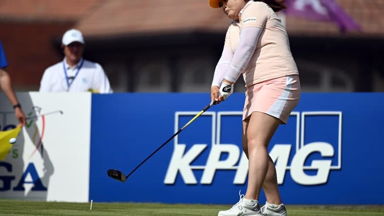 Jun 26, 2021; John's Creek, Georgia, USA; Inbee Park plays her shot from the first tee during the third round of the KPMG Women's PGA Championship golf tournament at the Atlanta Athletic Club. Mandatory Credit: Adam Hagy-USA TODAY Sports