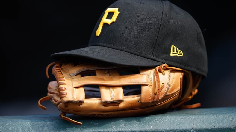 Jun 30, 2021; Denver, Colorado, USA; A general view of a Pittsburgh Pirates glove and hat in the eighth inning against the Colorado Rockies at Coors Field. Mandatory Credit: Isaiah J. Downing-USA TODAY Sports