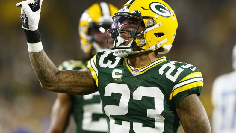 Sep 20, 2021; Green Bay, Wisconsin, USA; Green Bay Packers cornerback Jaire Alexander (23) celebrates after breaking up a pass during the second quarter against the Detroit Lions at Lambeau Field. Mandatory Credit: Jeff Hanisch-USA TODAY Sports