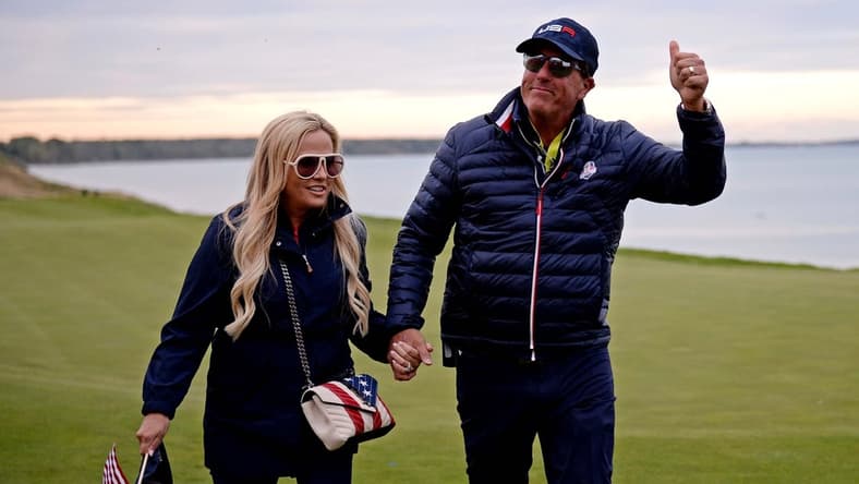 Sep 25, 2021; Haven, Wisconsin, USA; Team USA vice-captain Phil Mickelson and his wife Amy Mickelson on the 17th green during day two four-ball rounds for the 43rd Ryder Cup golf competition at Whistling Straits. Mandatory Credit: Orlando Ramirez-USA TODAY Sports