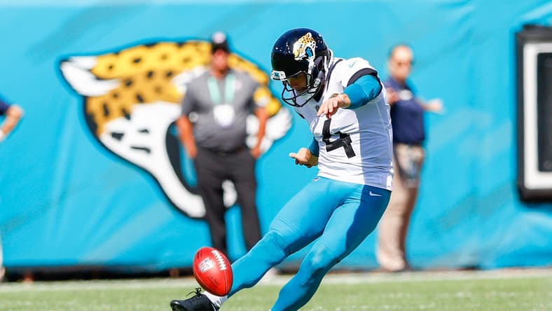 Sep 26, 2021; Jacksonville, Florida, USA;  Jacksonville Jaguars kicker Josh Lambo (4) kicks the ball in the third quarter against the Arizona Cardinals at TIAA Bank Field. Mandatory Credit: Nathan Ray Seebeck-USA TODAY Sports