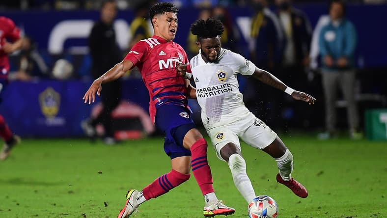 Oct 23, 2021; Carson, California, USA; FC Dallas midfielder Edwin Cerrillo (6) plays for the ball against Los Angeles Galaxy midfielder Oniel Fisher (91) during the second half at StubHub Center. Mandatory Credit: Gary A. Vasquez-USA TODAY Sports