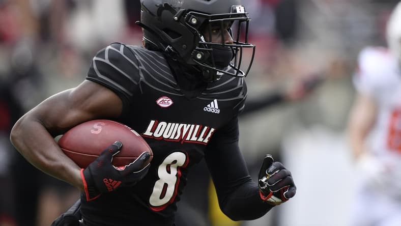 Nov 13, 2021; Louisville, Kentucky, USA;  Louisville Cardinals wide receiver Tyler Harrell (8) runs the ball against the Syracuse Orange during the first quarter  at Cardinal Stadium. Louisville defeated Syracuse 41-3. Mandatory Credit: Jamie Rhodes-USA TODAY Sports
