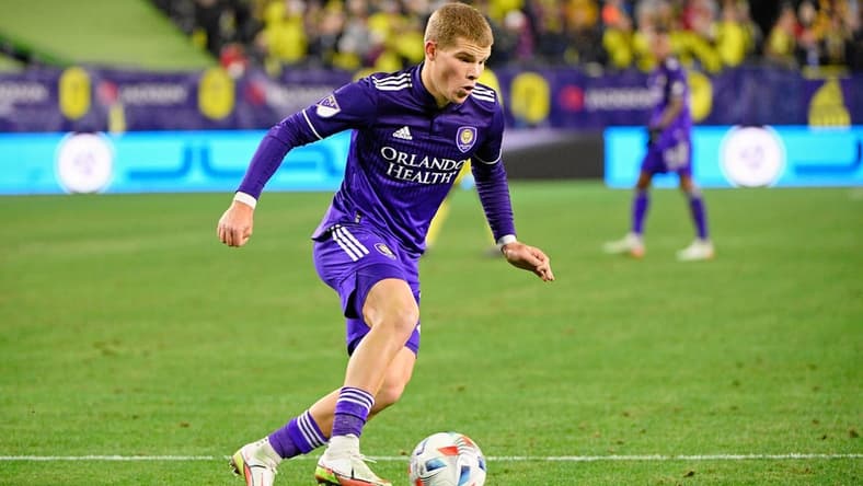 Nov 23, 2021; Nashville, TN, USA; Orlando City forward Chris Mueller (9) dribbles the ball against Nashville SC during the second half of a round one MLS Playoff game at Nissan Stadium. Mandatory Credit: Steve Roberts-USA TODAY Sports
