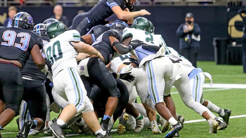 Zachary quarterback Eli Holstein (10) leaps in for a 1-yard score in the third quarter of the Class 5A State Championship game between Ponchatoula and Zachary at the Caesars Superdome on Saturday, December 11, 2021. (Michael DeMocker)

Class5achamp07