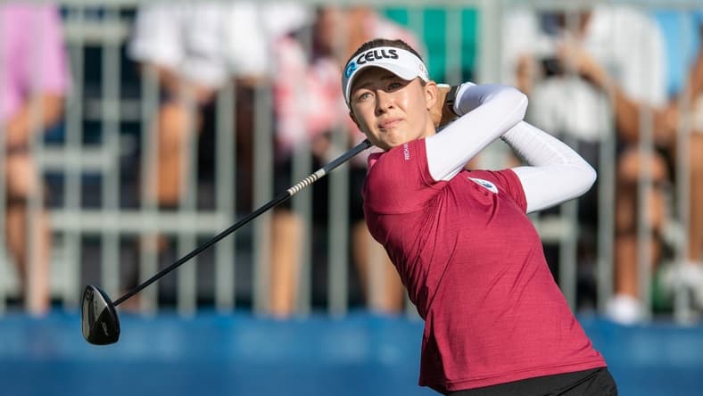 Dec 16, 2021; Orlando, Florida, USA; Nelly Korda plays her shot from the first tee during a pro-am round of the PNC Championship golf tournament at Grande Lakes Orlando Course. Mandatory Credit: Jeremy Reper-USA TODAY Sports