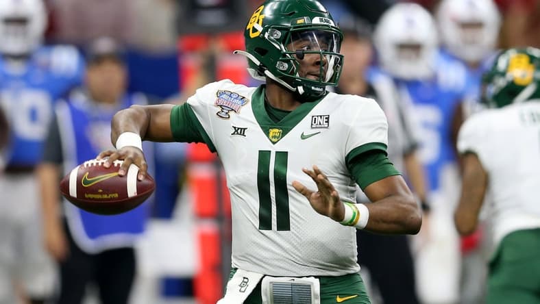 Jan 1, 2022; New Orleans, LA, USA; Baylor Bears quarterback Gerry Bohanon (11) throws a pass against the Mississippi Rebels in the third quarter of the 2022 Sugar Bowl at the Caesars Superdome. Mandatory Credit: Chuck Cook-USA TODAY Sports