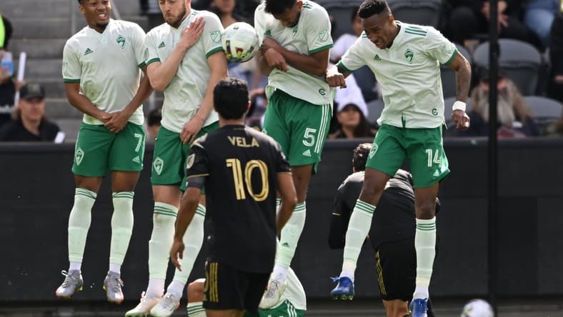 Feb 26, 2022; Los Angeles, California, USA; Los Angeles FC forward Carlos Vela (10) looks on as the Colorado Rapids defend against a free kick during the game at Banc of California Stadium. Mandatory Credit: Jayne Kamin-Oncea-USA TODAY Sports