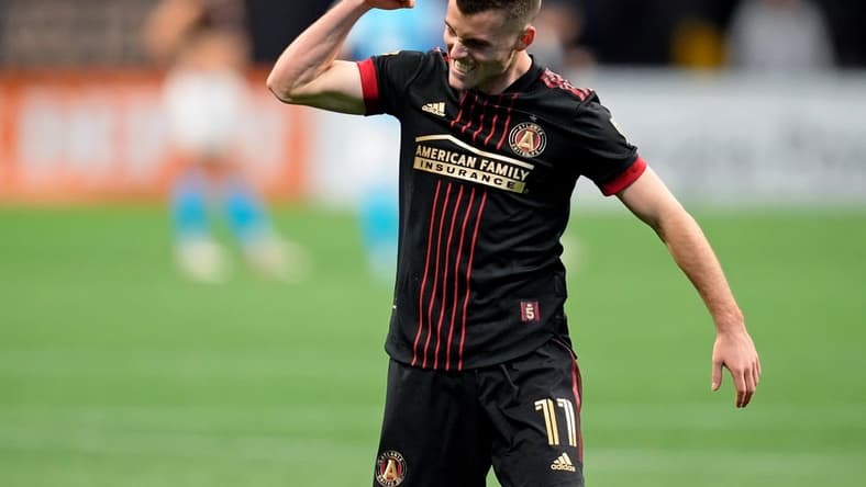 Mar 13, 2022; Atlanta, Georgia, USA; Atlanta United defender Brooks Lennon (11) celebrate their win against Charlotte FC during the second half at Mercedes-Benz Stadium. Atlanta United won 2-1. Mandatory Credit: Dale Zanine-USA TODAY Sports