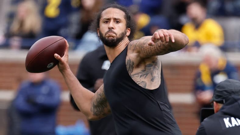 Apr 2, 2022; Ann Arbor, Michigan, USA; Colin Kaepernick passes during halftime at the Michigan Spring game at Michigan Stadium. Mandatory Credit: Rick Osentoski-USA TODAY Sports