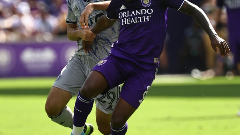 Feb 27, 2022; Orlando, Florida, USA; CF Montreal midfielder Mathieu Choini re (29) and Orlando City SC midfielder Sebas Mendez (8) fight to control the ball during the second half at Orlando City Stadium. Mandatory Credit: Kim Klement-USA TODAY Sports
