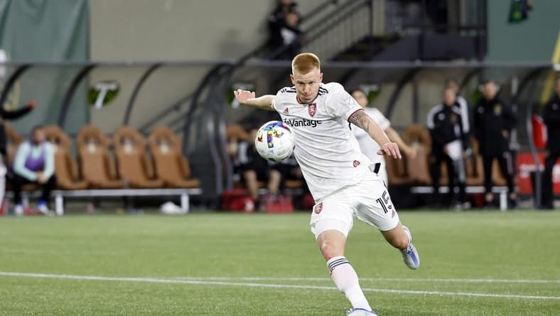 Apr 23, 2022; Portland, Oregon, USA; Real Salt Lake defender Justen Glad (15) takes a shot on goal during the second half against the Portland Timbers at Providence Park. Mandatory Credit: Soobum Im-USA TODAY Sports