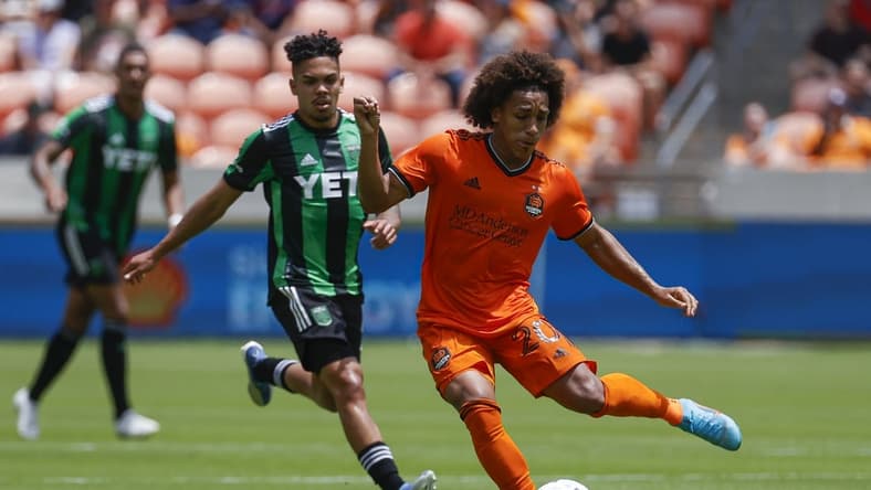 Apr 30, 2022; Houston, Texas, USA; Houston Dynamo FC midfielder Adalberto Carrasquilla (20) passes the ball during the first half against the Austin FC at PNC Stadium. Mandatory Credit: Troy Taormina-USA TODAY Sports
