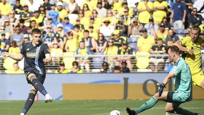 May 1, 2022; Nashville, Tennessee, USA; Philadelphia Union forward Mikael Uhre (7) takes a shot on goal past Nashville SC goalkeeper Joe Willis (1) and scores during the second half at Geodis Park. Mandatory Credit: Steve Roberts-USA TODAY Sports