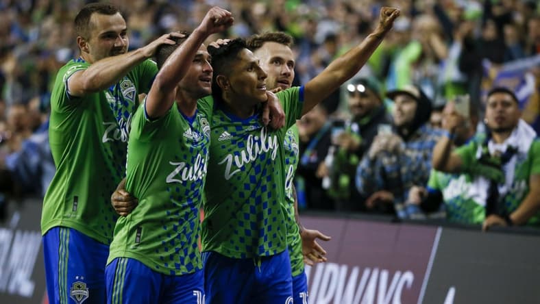 May 4, 2022; Seattle, WA, USA; Seattle Sounders FC forward Ra  l Ruid  az (9, second from right) celebrates with forward Jordan Morris (13, left), midfielder Nicol  s Lodeiro (10) and midfielder Albert Rusn  k (11, right) after scoring a goal against Pumas during the second half of the second leg of the Concacaf Champions League Final at Lumen Field. Mandatory Credit: Joe Nicholson-USA TODAY Sports