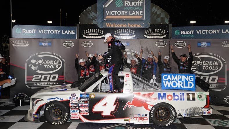 May 6, 2022; Darlington, South Carolina, USA; NASCAR Truck Series driver John Hunter Nemechek (4) celebrates winning the Dead On Tools 200 at Darlington Raceway. Mandatory Credit: Jasen Vinlove-USA TODAY Sports