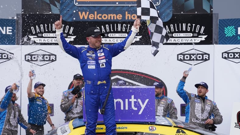May 7, 2022; Darlington, South Carolina, USA; NASCAR Xfinity Series driver Justin Allgaier (7) celebrates after winning the Mahindra ROXOR 200 at Darlington Raceway. Mandatory Credit: Jasen Vinlove-USA TODAY Sports