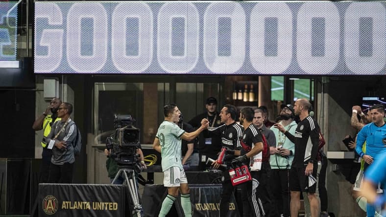 May 7, 2022; Atlanta, Georgia, USA; Atlanta United Ronaldo Cisneros (29) reacts with the bench after scoring his third goal of the first half against the Chicago Fire during the first half at Mercedes-Benz Stadium. Mandatory Credit: Dale Zanine-USA TODAY Sports