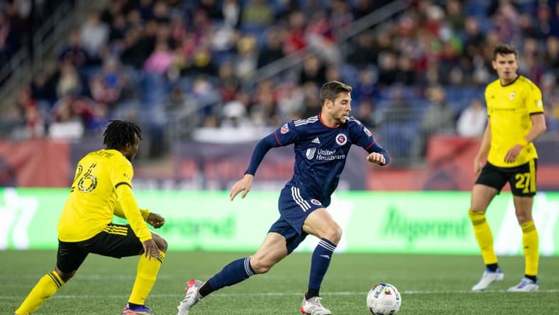 May 7, 2022; Foxborough, Massachusetts, USA; New England Revolution midfielder Matt Polster (8) possesses the ball during the first half against the Columbus Crew at Gillette Stadium. Mandatory Credit: Paul Rutherford-USA TODAY Sports