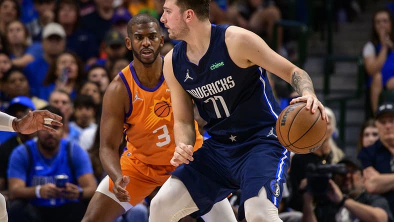 May 8, 2022; Dallas, Texas, USA; Phoenix Suns guard Chris Paul (3) guards Dallas Mavericks guard Luka Doncic (77) during the second quarter during game four of the second round for the 2022 NBA playoffs at American Airlines Center. Mandatory Credit: Jerome Miron-USA TODAY Sports