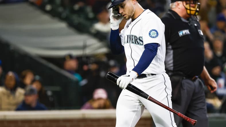 May 9, 2022; Seattle, Washington, USA; Seattle Mariners right fielder Jarred Kelenic (10) returns to the dugout after striking out against the Philadelphia Phillies during the second inning at T-Mobile Park. Mandatory Credit: Joe Nicholson-USA TODAY Sports