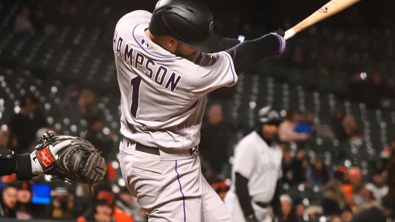 May 9, 2022; San Francisco, California, USA; Colorado Rockies center fielder Garrett Hampson (1) hits a ground rule double against the San Francisco Giants during the ninth inning at Oracle Park. Mandatory Credit: Kelley L Cox-USA TODAY Sports