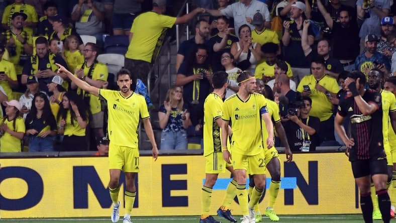 May 11, 2022; Nashville, Tennessee, USA; Nashville SC forward Ethan Zubak (11) celebrates after scoring the game-winning goal in overtime against the Atlanta United at Geodis Park. Mandatory Credit: Christopher Hanewinckel-USA TODAY Sports