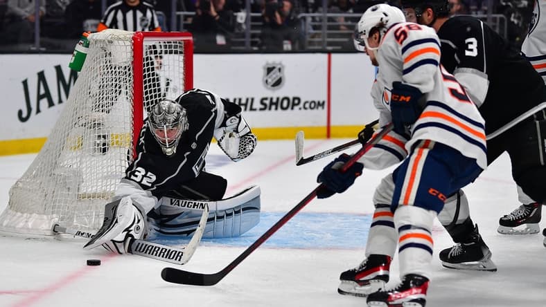 May 12, 2022; Los Angeles, California, USA; Los Angeles Kings goaltender Jonathan Quick (32) defends the goal against Edmonton Oilers right wing Kailer Yamamoto (56) during the third period in game six of the first round of the 2022 Stanley Cup Playoffs at Crypto.com Arena. Mandatory Credit: Gary A. Vasquez-USA TODAY Sports