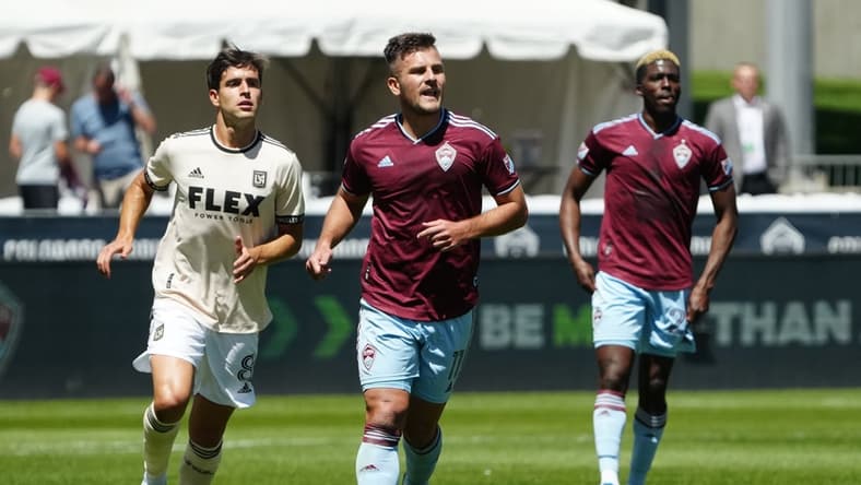 May 14, 2022; Commerce City, Colorado, USA; Los Angeles FC midfielder Francisco Ginella (8) and Colorado Rapids forward Diego Rubio (11) during the first half at Dick's Sporting Goods Park. Mandatory Credit: Ron Chenoy-USA TODAY Sports