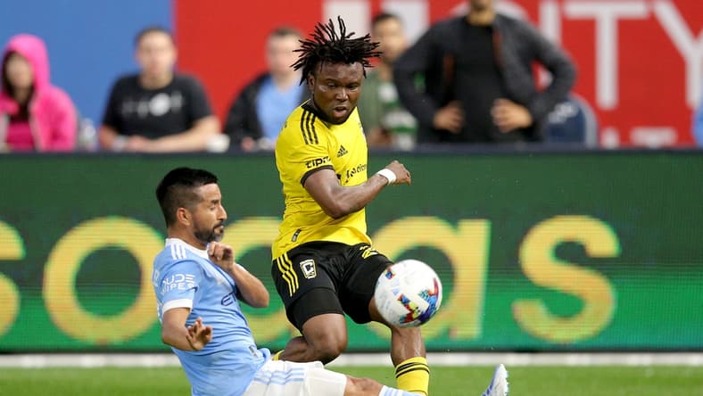 May 14, 2022; New York, New York, USA; Columbus Crew midfielder James Igbekeme (26) passes the ball around New York City FC midfielder Maximiliano Moralez (10) during the first half at Yankee Stadium. Mandatory Credit: Brad Penner-USA TODAY Sports