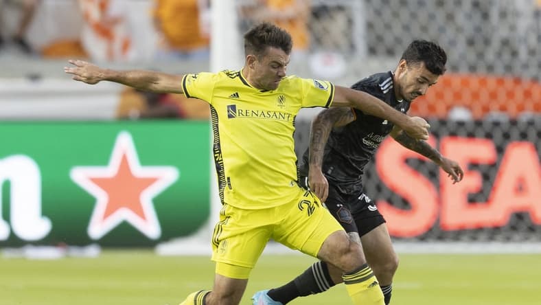 May 14, 2022; Houston, Texas, USA; Nashville SC midfielder Brian Anunga (27) fights Houston Dynamo defender Zeca (37) for the ball in the first half at PNC Stadium. Mandatory Credit: Thomas Shea-USA TODAY Sports