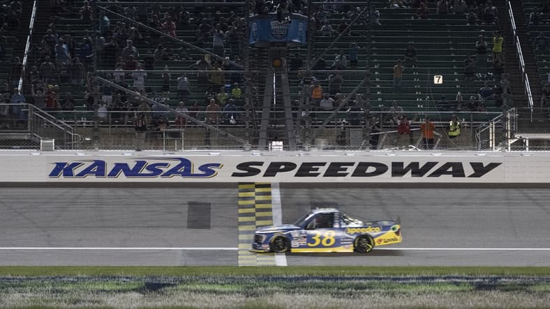 May 14, 2022; Kansas City, Kansas, USA; NASCAR Truck Series driver Zane Smith (38) crosses the finish line to win the Truck Series Heart of America 200 at Kansas Speedway. Mandatory Credit: Amy Kontras-USA TODAY Sports