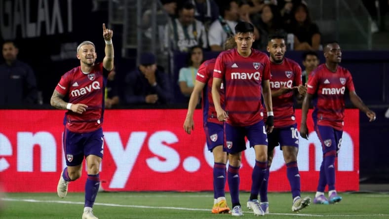 May 14, 2022; Carson, California, USA;  FC Dallas forward Paul Arriola (left) reacts after scoring a goal against the Los Angeles Galaxy during the first half at Dignity Health Sports Park. Mandatory Credit: Kiyoshi Mio-USA TODAY Sports