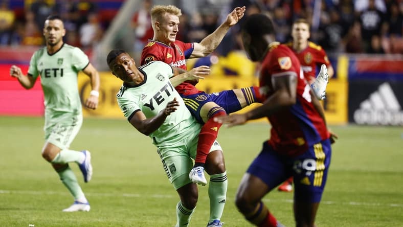 May 14, 2022; Sandy, Utah, USA;  Austin FC midfielder Jhojan Valencia (5) and Real Salt Lake defender Jasper Loffelsend (28) battle in the second half at Rio Tinto Stadium. Mandatory Credit: Jeffrey Swinger-USA TODAY Sports