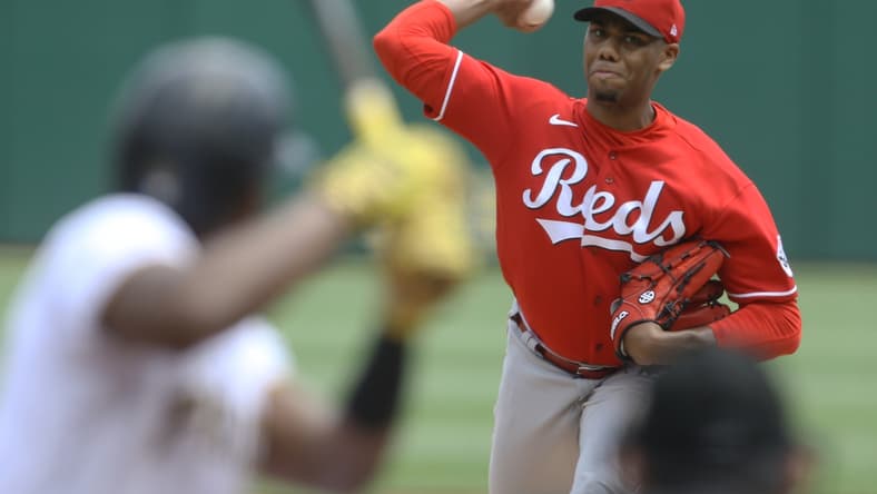 May 15, 2022; Pittsburgh, Pennsylvania, USA; Cincinnati Reds starting pitcher Hunter Greene (21) pitches to Pittsburgh Pirates third baseman Ke'Bryan Hayes (13) during the first inning at PNC Park. Mandatory Credit: Charles LeClaire-USA TODAY Sports