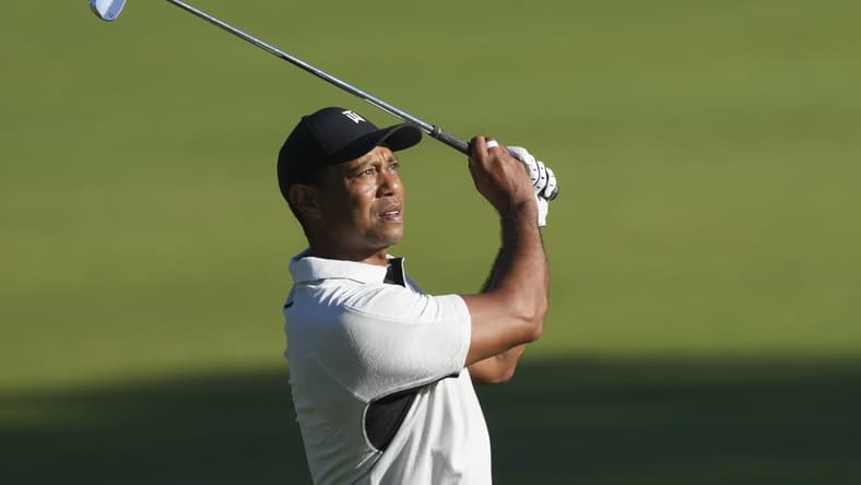 May 16, 2022; Tulsa, Oklahoma, USA; Tiger Woods watches his fairway shot on the 10th hole during a practice round for the PGA Championship golf tournament at Southern Hills Country Club. Mandatory Credit: Michael Madrid-USA TODAY Sports