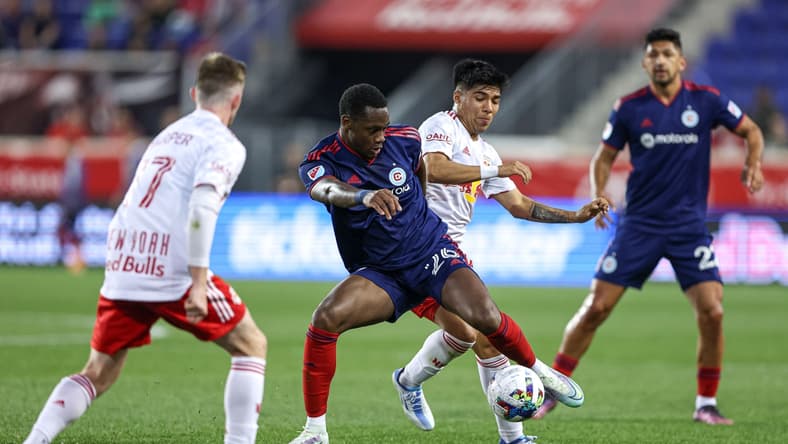 May 18, 2022; Harrison, New Jersey, USA; Chicago Fire forward Jhon Duran (26) plays the ball in front of New York Red Bulls midfielder Omir Fernandez (21) during the first half at Red Bull Arena. Mandatory Credit: Vincent Carchietta-USA TODAY Sports