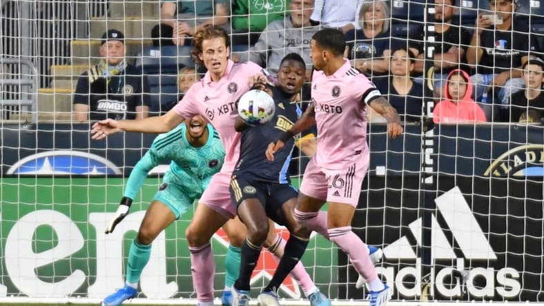 May 18, 2022; Chester, Pennsylvania, USA; Philadelphia Union forward Cory Burke (19) battles for the ball with Inter Miami defender Ryan Sailor (45) and midfielder Gregore (26) during the first half against the Inter Miami at Subaru Park. Mandatory Credit: Eric Hartline-USA TODAY Sports