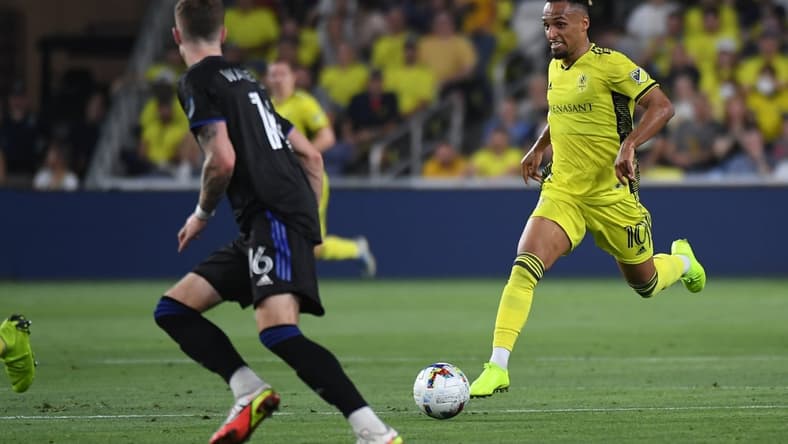 May 18, 2022; Nashville, Tennessee, USA; Nashville SC midfielder Hany Mukhtar (10) handles the ball into the offensive zone during the first half against the CF Montreal at GEODIS Park. Mandatory Credit: Christopher Hanewinckel-USA TODAY Sports