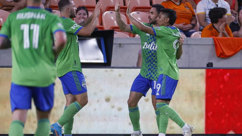 May 18, 2022; Houston, Texas, USA; Seattle Sounders FC forward Raul Ruidiaz (9) celebrates with teammates after scoring a goal during the first half against the Houston Dynamo FC at PNC Stadium. Mandatory Credit: Troy Taormina-USA TODAY Sports