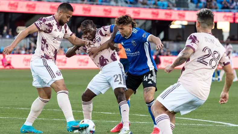 May 18, 2022; San Jose, California, USA; Portland Timbers midfielder Diego Char   (21) and San Jose Earthquakes forward Cade Cowell (44) battle for possession during the first half at PayPal Park. Mandatory Credit: John Hefti-USA TODAY Sports
