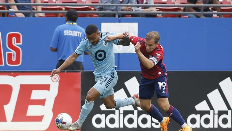 May 22, 2022; Frisco, Texas, USA; Minnesota United defender D.J. Taylor (27) and FC Dallas midfielder Paxton Pomykal (19) fight for the ball in the first half at Toyota Stadium. Mandatory Credit: Tim Heitman-USA TODAY Sports