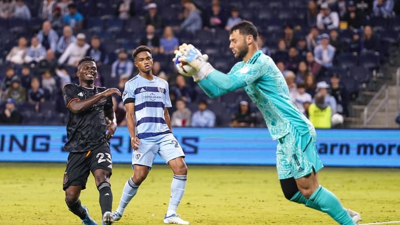 May 25, 2022; Kansas City, Kansas, USA; Houston Dynamo forward Carlos Darwin Quintero (23) reacts after a stop by Sporting Kansas City goalkeeper John Pulskamp (1) as defender Kayden Pierre (24) looks on during the second half at Children's Mercy Park. Mandatory Credit: Jay Biggerstaff-USA TODAY Sports