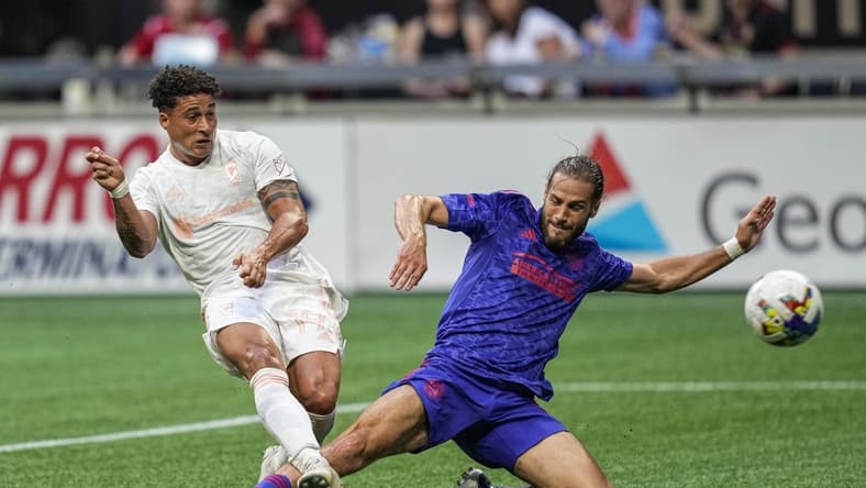 May 28, 2022; Atlanta, Georgia, USA; Columbus Crew forward Erik Hurtado (19) scores a goal past Atlanta United defender Alex De John (3) during the first half at Mercedes-Benz Stadium. Mandatory Credit: Dale Zanine-USA TODAY Sports
