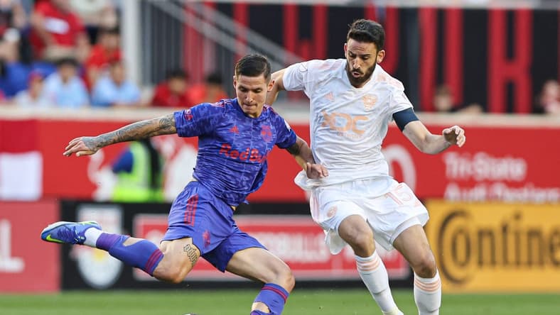 May 28, 2022; Harrison, New Jersey, USA; New York Red Bulls forward Patryk Klimala (9) plays the ball against D.C. United defender Steve Birnbaum (15) during the first half at Red Bull Arena. Mandatory Credit: Vincent Carchietta-USA TODAY Sports