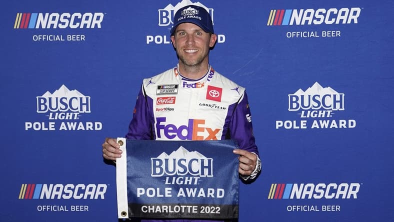 May 28, 2022; Concord, North Carolina, USA; NASCAR Cup Series driver Denny Hamlin poses for a picture after winning the pole for the Coca-Cola 600 at Charlotte Motor Speedway. Mandatory Credit: Jasen Vinlove-USA TODAY Sports